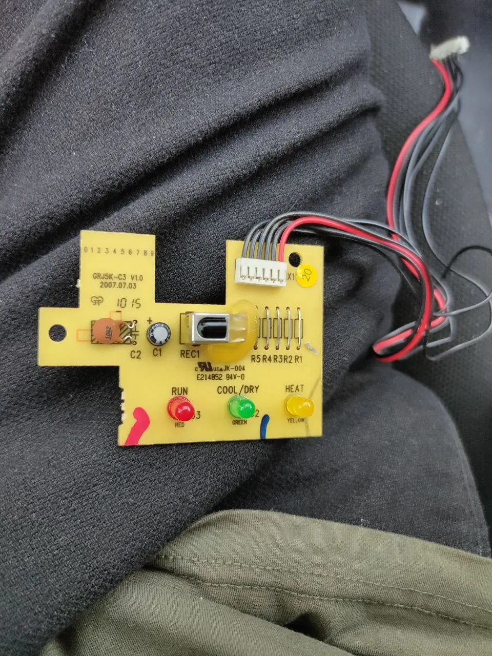 Close-up photo of an AC control board label with wiring and mode markings for unit-specific checks Close-up photo of an AC control board label with wiring and mode markings for unit-specific checks